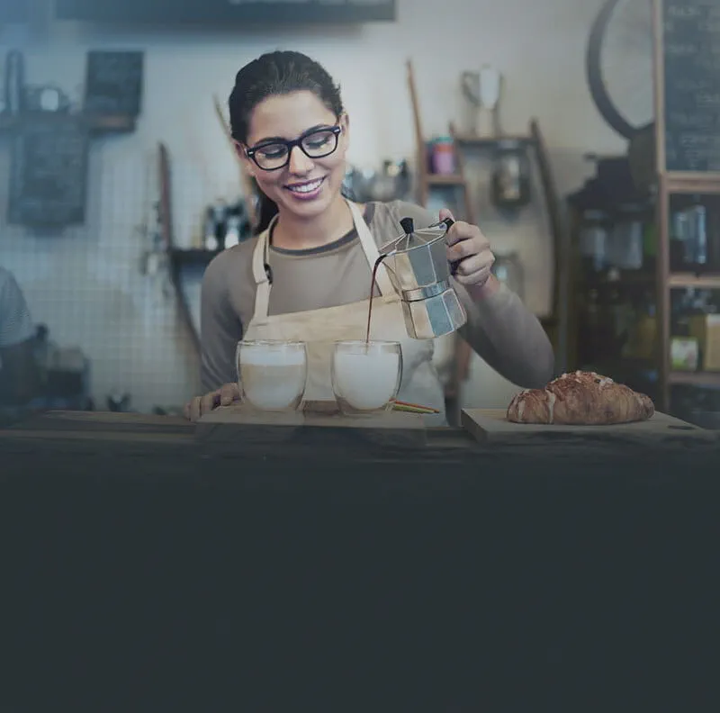 Lady powering coffee from Barista