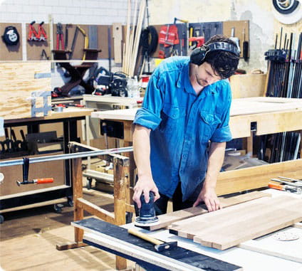 Carpenter polishing wood 