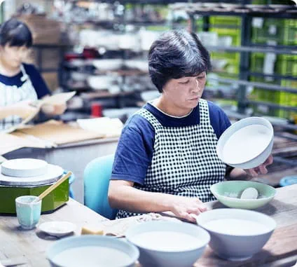 Ladies painting ceramic bowls